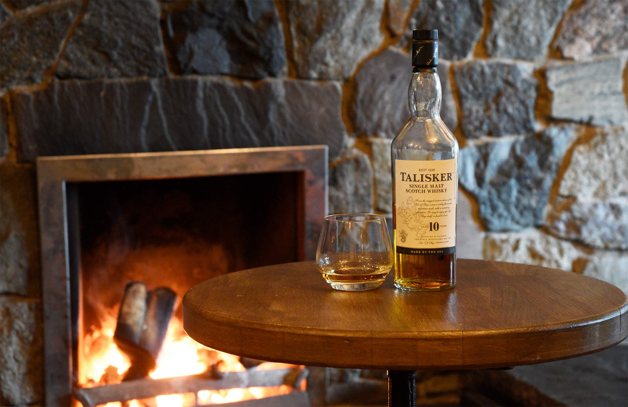 Enjoy a drink of Talisker at the Old School Restaurant Dunvegan Open Place Fire